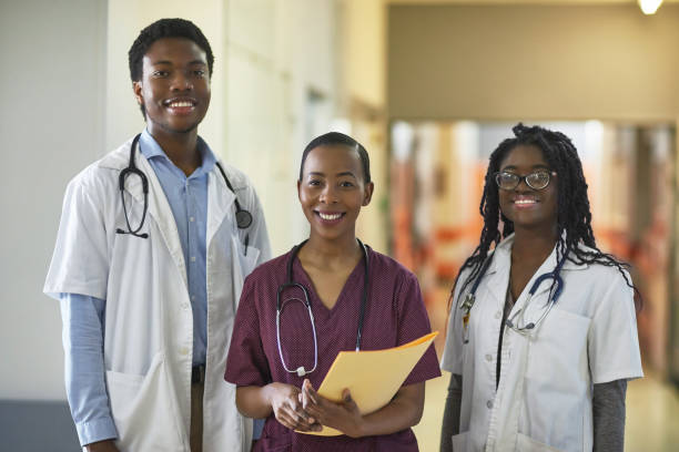 istock Confident healthcare workers standing in corridor 1063686646