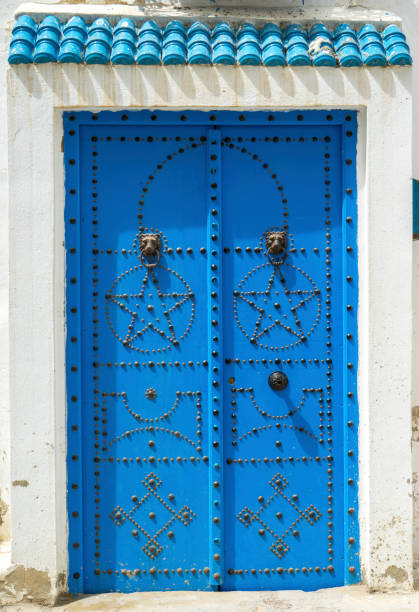 istock Aged Blue door in Andalusian style from Sidi Bou Said 1063687968