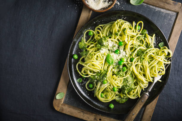 istock Tasty pasta with pesto served on plate 1063694034