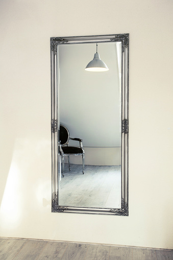 Long mirror on the wall with Modern shining interior clean empty close-up