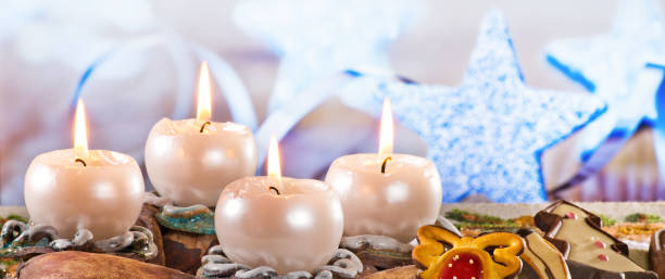 istock Advent Wreath with Burning Candles on the Table 1063694102
