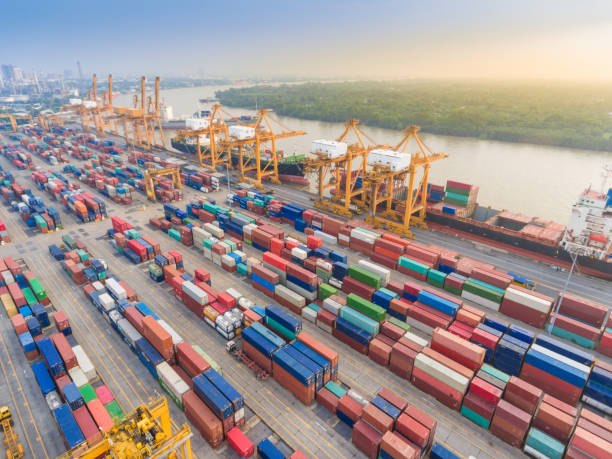 istock Logistics and transportation of Container Cargo ship and Cargo working crane bridge in shipyard 1063703424