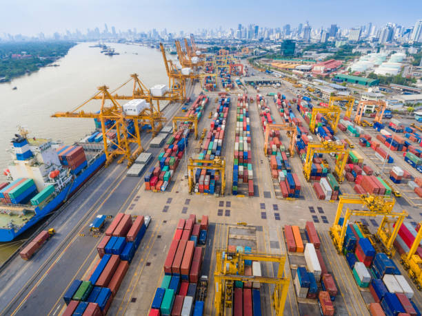 istock Logistics and transportation of Container Cargo ship and Cargo working crane bridge in shipyard 1063703486