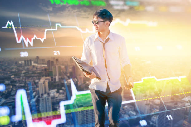 istock Asian business man using laptop and digital tablet in Singapore 1063704462
