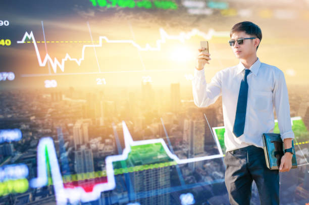 istock Asian business man using laptop and digital tablet in Singapore 1063705812