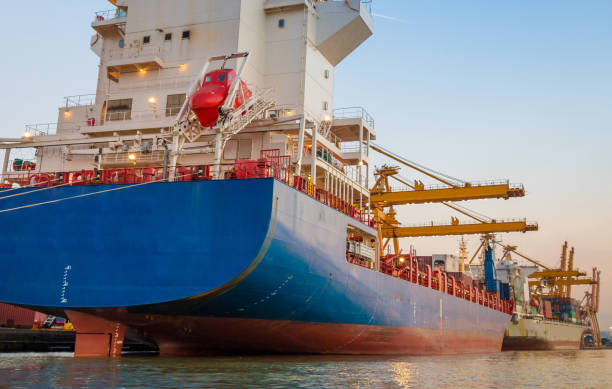 istock Logistics and transportation of Container Cargo ship and Cargo working crane bridge in shipyard 1063706504