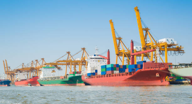 istock Logistics and transportation of Container Cargo ship and Cargo working crane bridge in shipyard 1063706690
