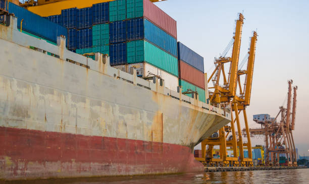 istock Logistics and transportation of Container Cargo ship and Cargo working crane bridge in shipyard 1063707066