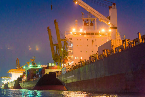 istock Logistics and transportation of Container Cargo ship and Cargo working crane bridge in shipyard 1063707078