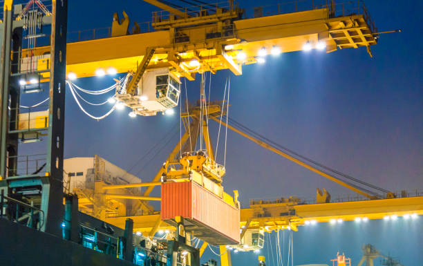 istock Logistics and transportation of Container Cargo ship and Cargo working crane bridge in shipyard 1063707188