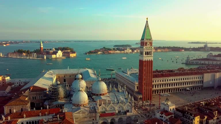 Aerial view of Venice panoramic landmark, aerial view of Piazza San Marco or st Mark square, Campanile and Ducale or Doge Palace. Italy, Europe. Drone shot at sunset