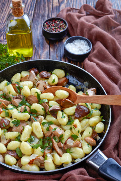 istock Potato gnocchi with mushrooms, top view 1063710518
