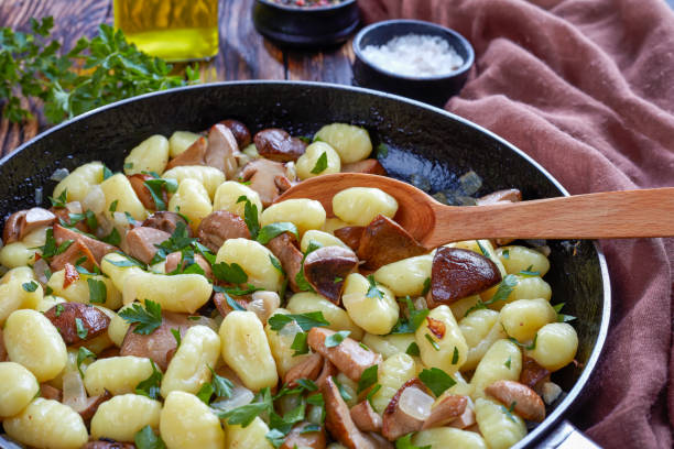 istock Potato gnocchi with porcini on a skillet 1063710562