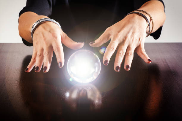 istock Fortune teller or soothsayer with a crystal ball 1063710866