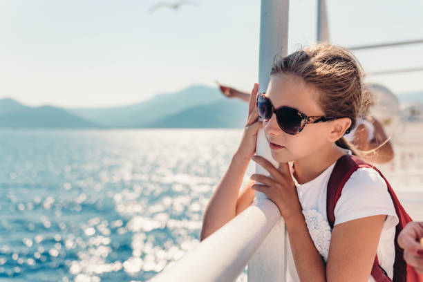 istock Girl standing on a ship deck at ferry 1063710952