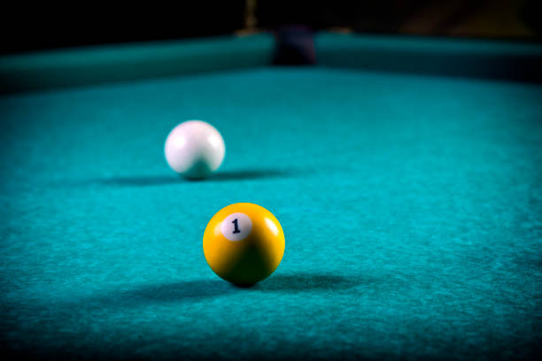 istock Billiard balls in a blue pool table. Billiard game background. 1063712652