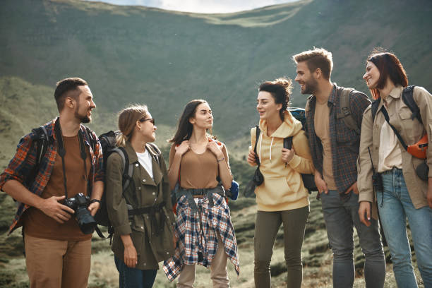 istock Young men and women smiling while discussing their future journey 1063714012