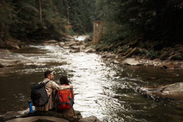 istock Young man hugging his beloved woman during their journey 1063714036