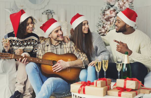 istock Happy young people celebrating Christmas at home 1063715272
