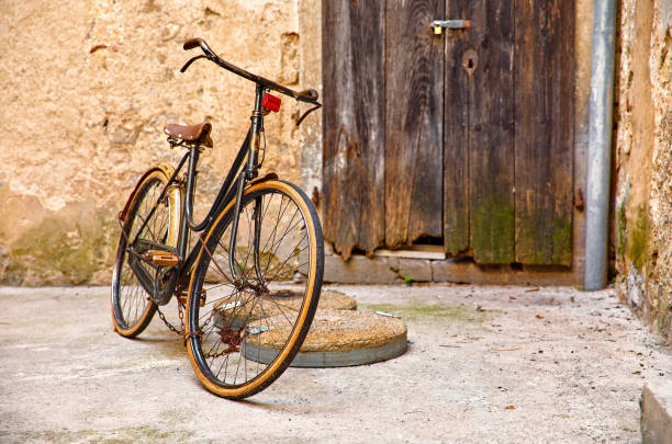 istock Old retro bicycle on vintage street 1063715812