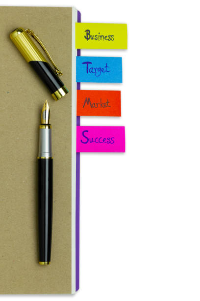 istock Multi colour  bookmark in business notebook and a pen. 1063721528