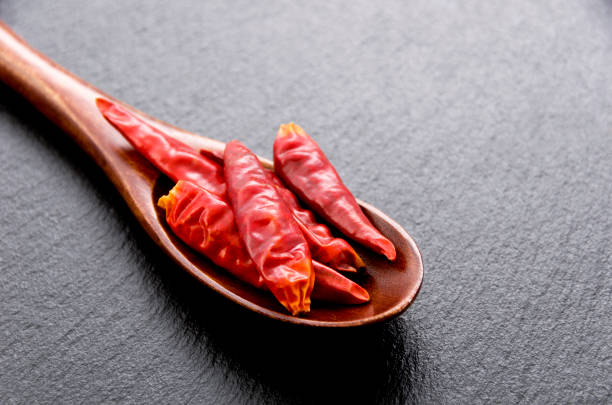 istock Capsicum annuum in a Wooden spoon on stone plate 1063721980