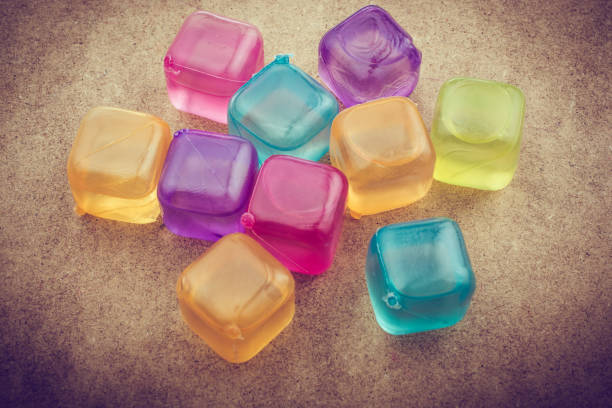 istock Fake colorful ice cubes  on wood 1063722146