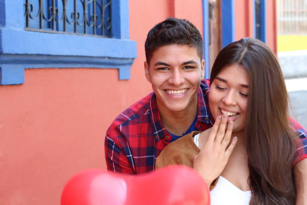 istock Expressive girl surprised by her boyfriend 1063724620