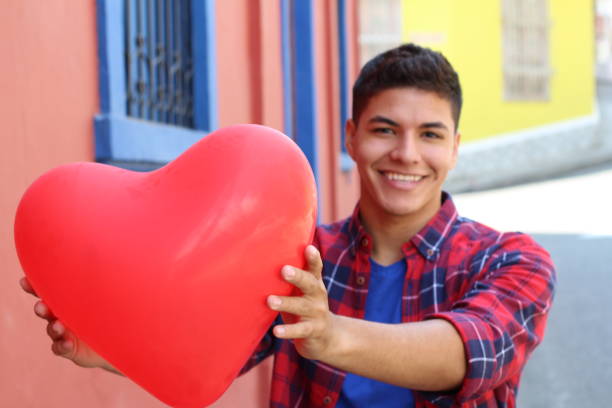 istock Male giving a red big heart 1063724654