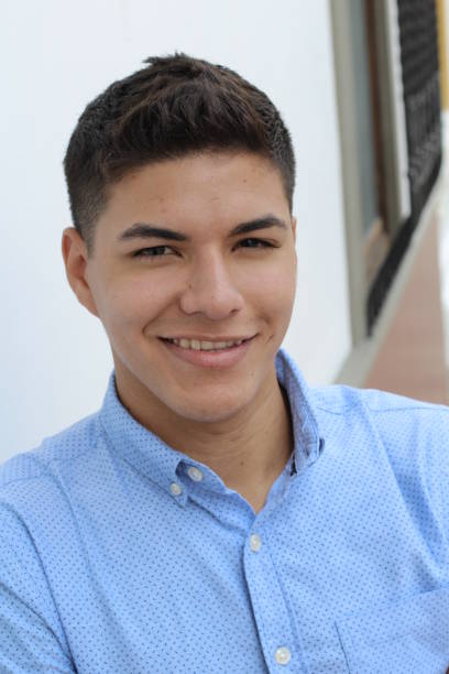 istock Young hispanic male wearing blue button up 1063724884