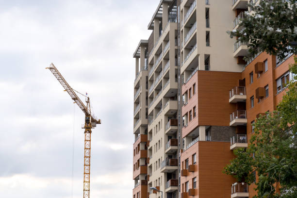 istock Modern apartment building with a construction crane. 1063727786