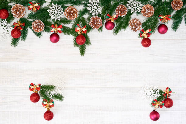 istock Festive composition of Christmas decorations on white wooden background. 1063730834