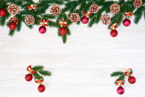 istock Festive composition of Christmas decorations on white wooden background. 1063731392