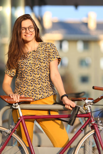 istock Girl with bicycle  lock. Bicycle U- lock 1063734830