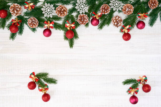 istock Festive composition of Christmas decorations on white wooden background. 1063735006