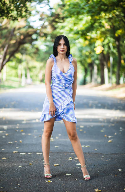 istock Beautiful young woman posing in a park 1063735306