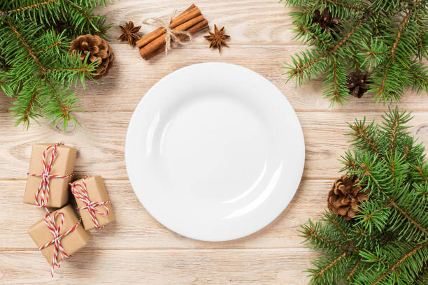 istock White Round Plate on white wooden table background. Perspective view 1063737776