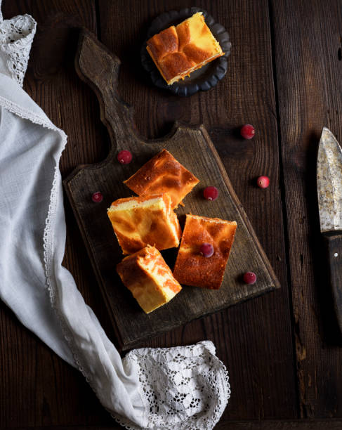 istock baked square pieces of pumpkin cheesecake 1063738628