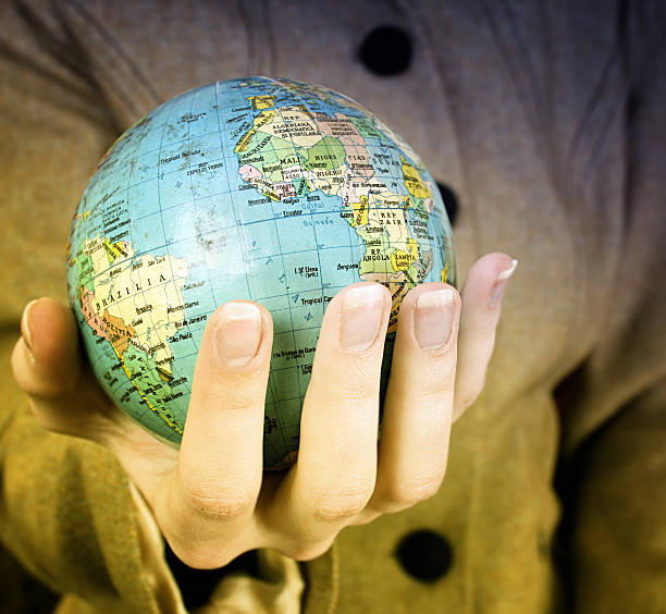 istock Globe in a girl's hands 106374033