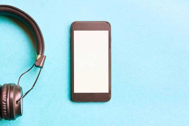 istock Headphones and smartphone on colorful background. 1063745726