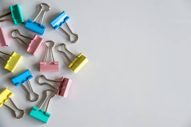 istock closeup paper clip on white table with soft-focus and over light in the background 1063747974