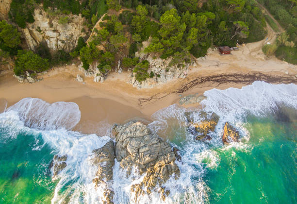 istock Beach full of rocks and waves in Spain 1063750506