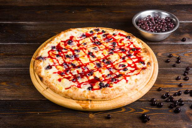 istock Fruit sweet pizza. Pizza for dessert. Pizza with sweet berries 1063750620