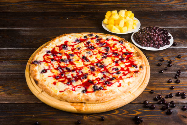 istock Fruit sweet pizza. Pizza for dessert. Pizza with sweet berries 1063750626
