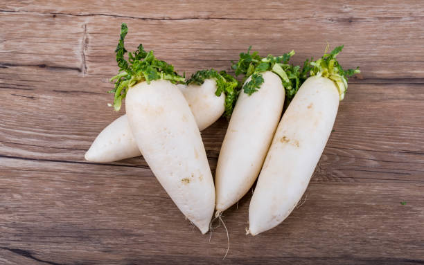 istock White organic radishes on the wooden table 1063751574