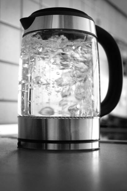 istock Electric kettle with boiling water in the kitchen 1063756120