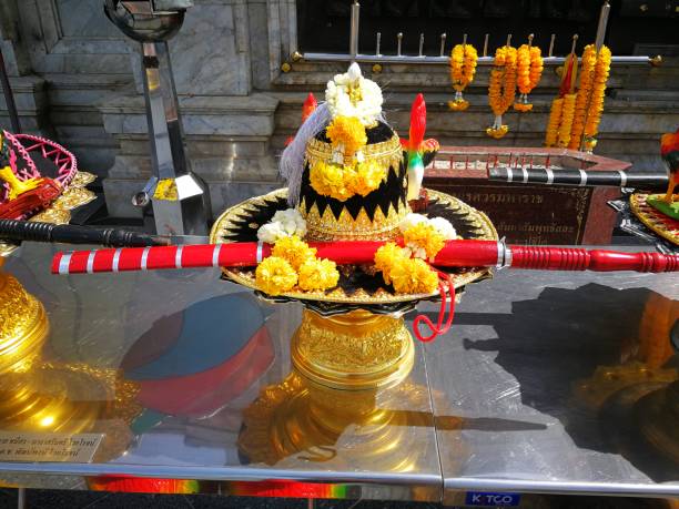 istock incense candles flowers cigarettes and  ceramic dolls  for Buddha statue 1063756148
