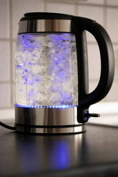 istock Electric kettle with boiling water in the kitchen 1063756536