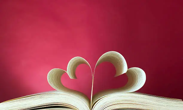 Photo of Opened book and heart shape