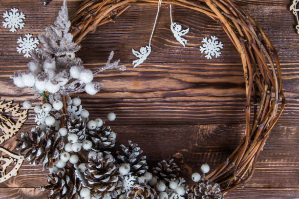istock Christmas winter frame on dark wooden background 1063764594